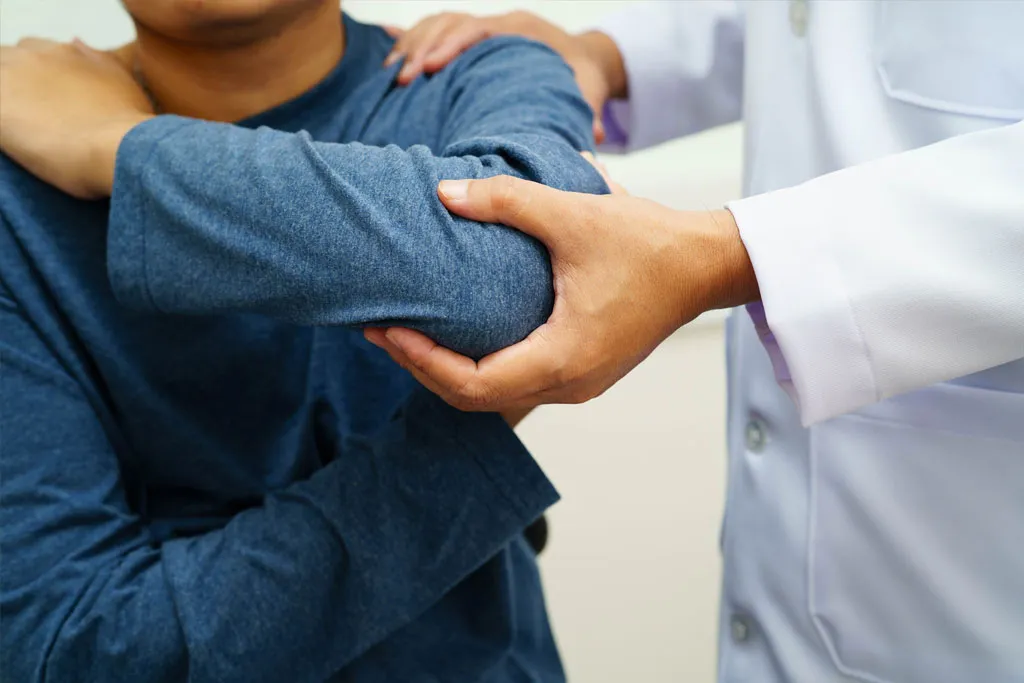 A doctor treating a patient for his sports injury
