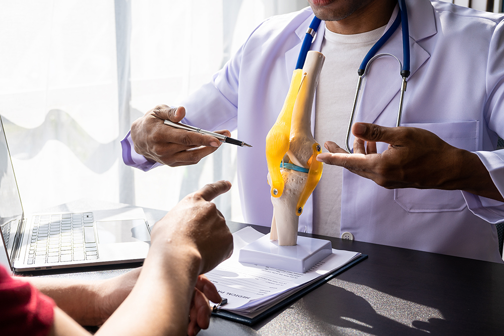 A specialist discussing long-term management of runner’s knee