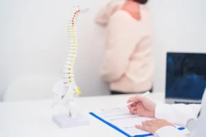 Patient consulting an orthopaedic surgeon about back pain